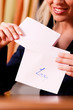 Photo: Woman is holding a love letter Woman is holding a love letter
