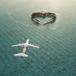 flight above heart-shaped tropical island flight above heart-shaped tropical island
