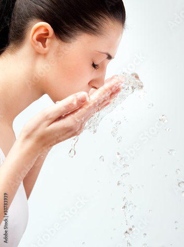 Photo: woman wash her face woman wash her face