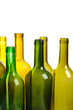Many empty green wine bottles isolated on white background