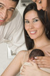 Photo: Happy Mom, Dad And Newborn Baby Happy Mom, Dad And Newborn Baby