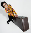 Beautiful woman posing at studio with baggage