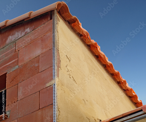Photo : Crépissage d'un mur en briques Crépissage d'un mur en briques