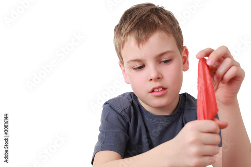 Photo: Boy hides shawl in fist is focus Boy hides shawl in fist is focus