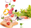 Delicious sandwich with ingredients in the air