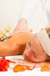 Woman enjoying wellness back massage
