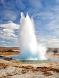 Photo : Famous Geyser eruption in a sunny day, Iceland Famous Geyser eruption in a sunny day, Iceland