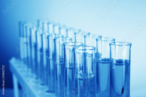 Photo: Test-tubes on blue background Test-tubes on blue background