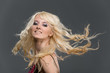 Portrait of beautiful young blonde girl with flying long hair Portrait of beautiful young blonde girl with flying long hair