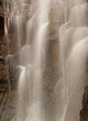 Closeup of a waterfall with blurred motion like white veil