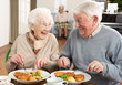 Photo: Senior Couple Enjoying Meal Together Senior Couple Enjoying Meal Together