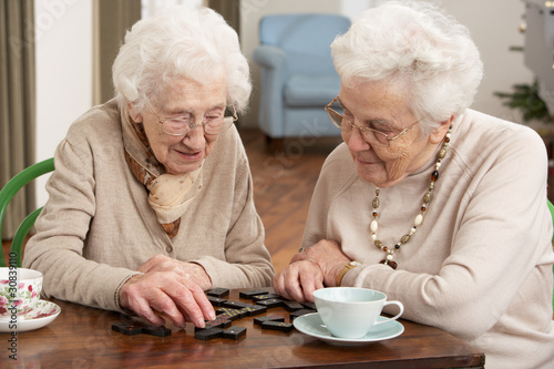 Photo: Two Senior Women Playing Dominoes At Day Care Centre Two Senior Women Playing Dominoes At Day Care Centre