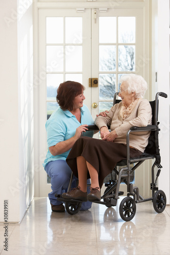 Photo: Carer With Disabled Senior Woman Sitting In Wheelchair Carer With Disabled Senior Woman Sitting In Wheelchair