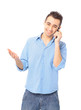 Smiling young man, wearing blue shirt, talking on mobile Smiling young man, wearing blue shirt, talking on mobile