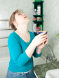 illness woman gargles her throat