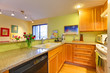 Happy yellow green kitchen with spring flowers