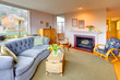 Lving room with fireplace and cozy blue sofa