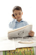 Photo: little boy reading newspaper little boy reading newspaper