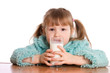 The little girl with a milk glass