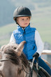 Horse riding - little girl is riding a horse