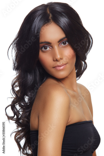 Photo: beautiful woman with long black curly hair. beautiful woman with long black curly hair.