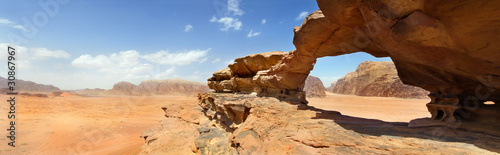 Photo: natural bridge and panoramic view of Wadi Rum desert, Jordan natural bridge and panoramic view of Wadi Rum desert, Jordan