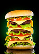 Tasty hamburger and french fries on a dark Tasty hamburger and french fries on a dark