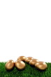 Golden easter egg on green grass Golden easter egg on green grass