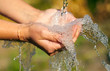 Woman's hands with water splash