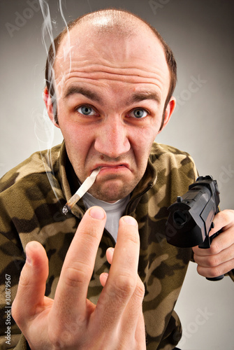 Photo: Impudent bandit with gun Impudent bandit with gun