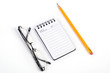 Glasses and pencil with notepad Glasses and pencil with notepad