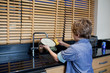 Boy doing the dishes in kitchen