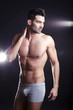Closeup of a muscular handsome man in underwear