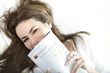 portrait of young brunette with magazine