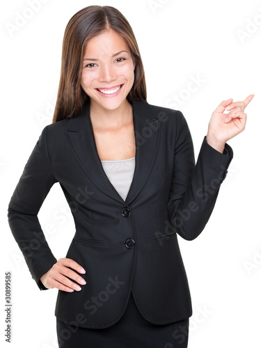Photo: Businesswoman in suit pointing Businesswoman in suit pointing