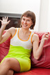 Amused woman with music player