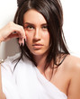 Portrait of attractive girl covering your body by white silk