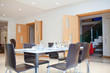 Photo: Laid table in modern dining room Laid table in modern dining room