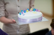 Woman serving birthday cake