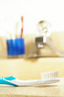 closeup of a toothbrush at the bathroom sink