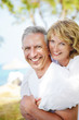 Mature couple smiling and embracing