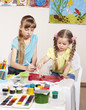Child painting in preschool.