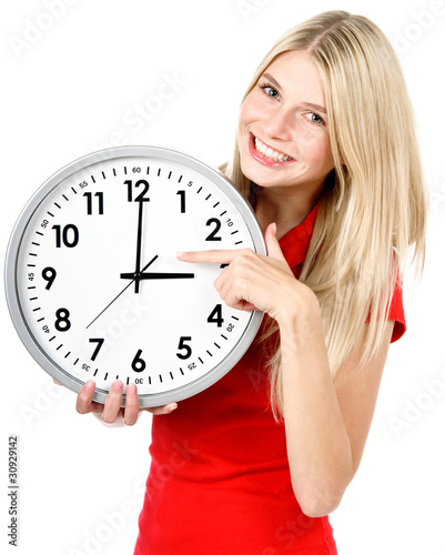 Photo: Young beautiful woman with the clock Young beautiful woman with the clock