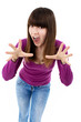 Teen girl with hands up portrait, over white background Teen girl with hands up portrait, over white background