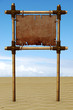 Signboard from bamboo sticks, on a sandy beach Signboard from bamboo sticks, on a sandy beach