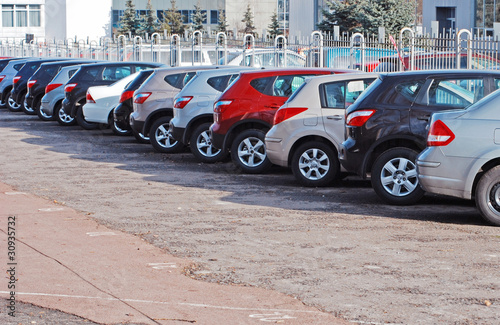 Photo: A row of parcked cars A row of parcked cars