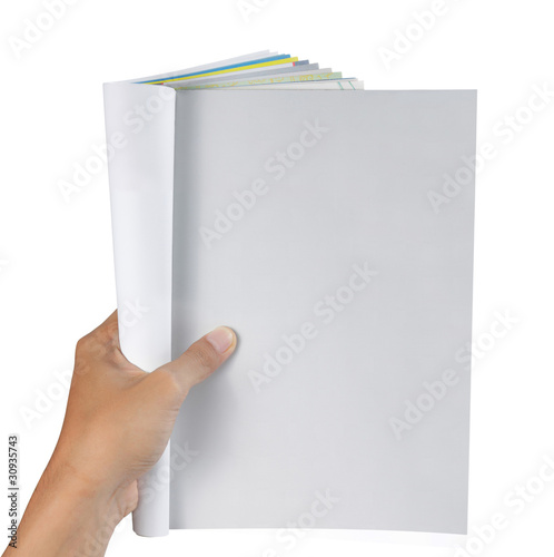 Photo: hand holding magazine hand holding magazine