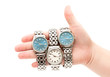 Three wristwatches on women`s hand isolated on white background Three wristwatches on women`s hand isolated on white background