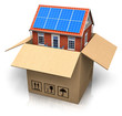 House with solar batteries in cardboard box