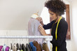 Woman working in fashion design studio